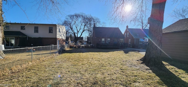 view of yard featuring fence private yard and a residential view