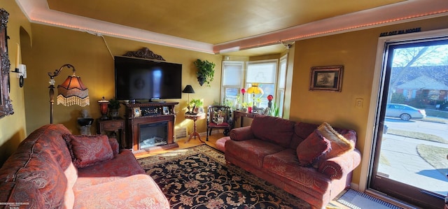 living room with a glass covered fireplace