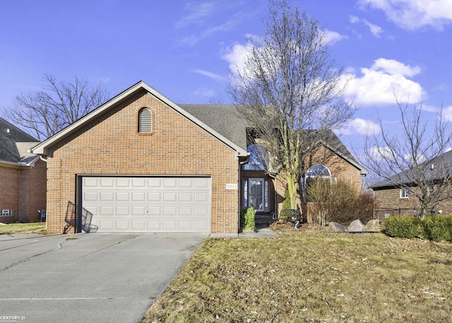 view of front of house featuring concrete driveway, an attached garage, and brick siding