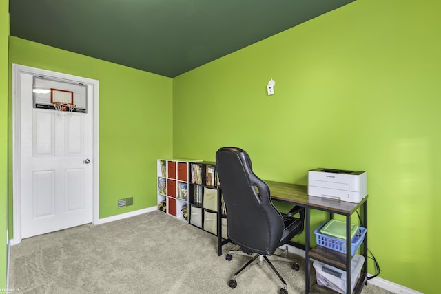 carpeted office with visible vents and baseboards