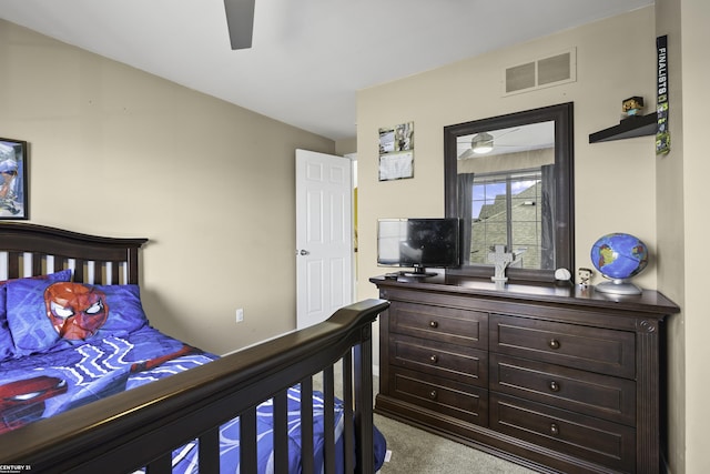 carpeted bedroom featuring visible vents and ceiling fan