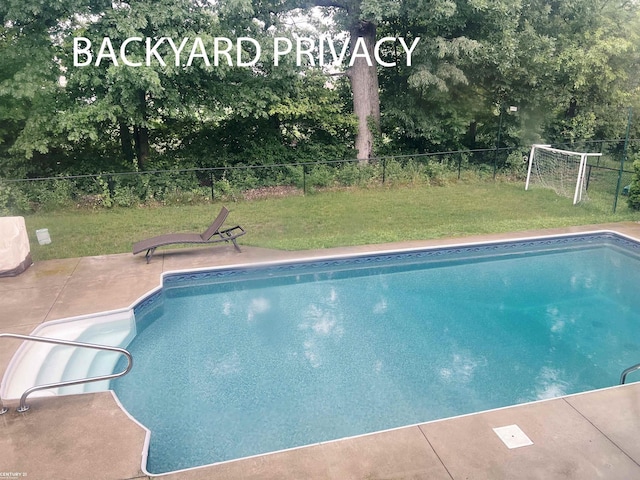 view of pool featuring a patio area, a yard, a fenced backyard, and a fenced in pool