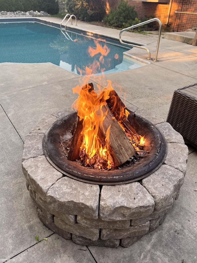 pool featuring cooling unit and a patio