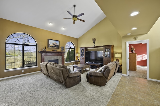 carpeted living room with visible vents, baseboards, high vaulted ceiling, recessed lighting, and a fireplace