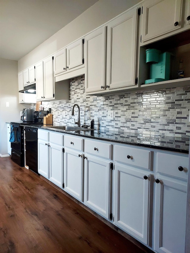 kitchen featuring backsplash, black dishwasher, dark wood-style flooring, white cabinetry, and a sink