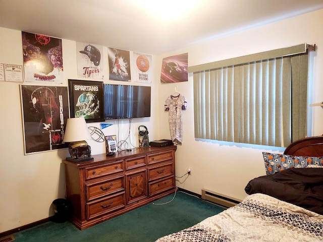 bedroom featuring a baseboard heating unit, baseboards, and carpet flooring