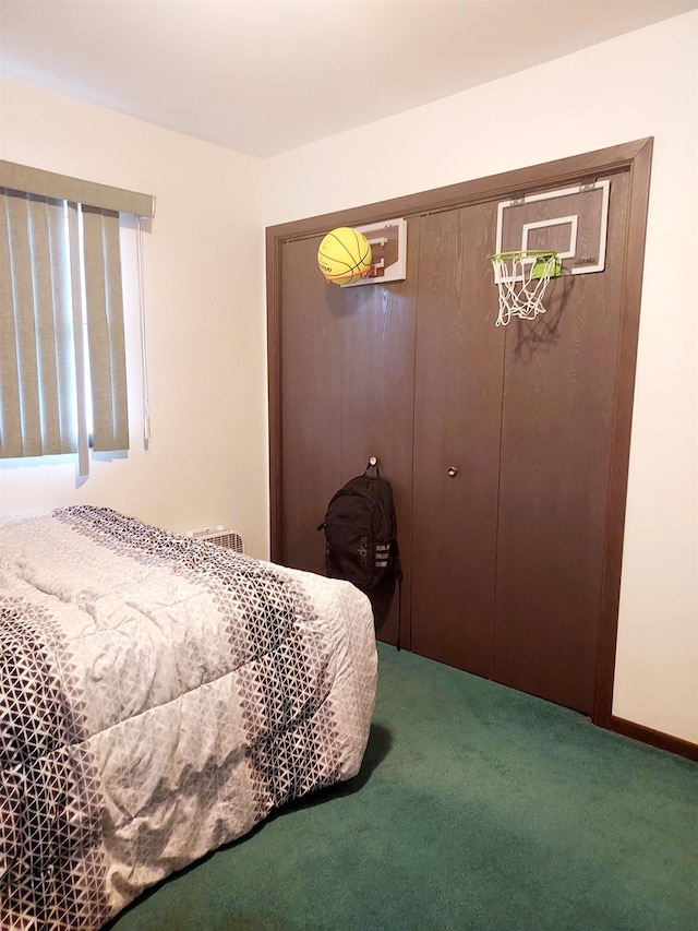 carpeted bedroom featuring a closet