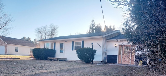 ranch-style home featuring an attached garage