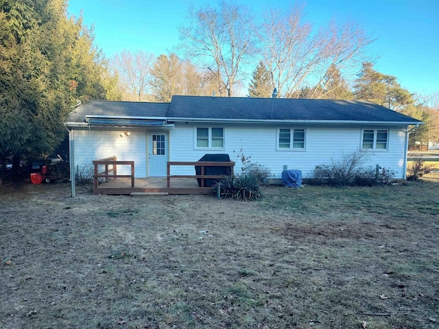 back of property with a deck