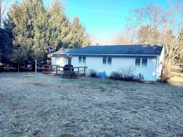 rear view of property with a deck