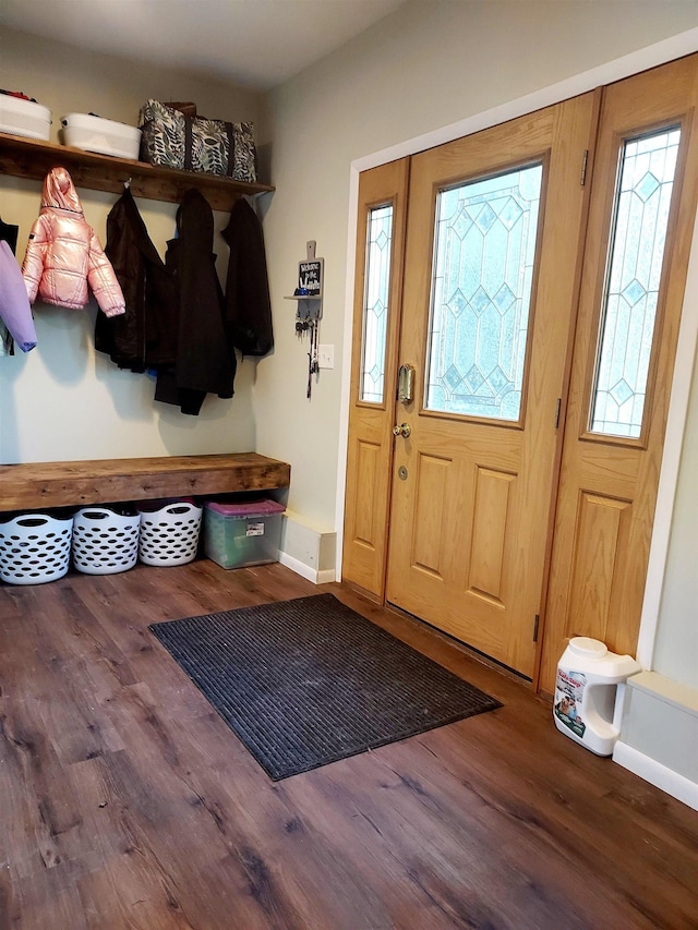 mudroom featuring baseboards and wood finished floors