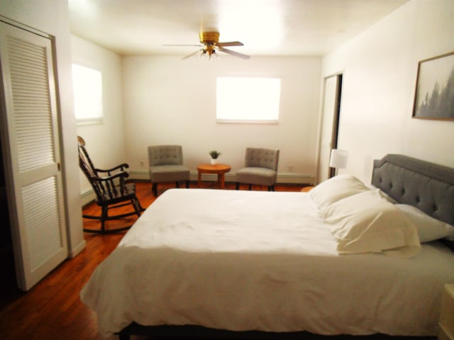 bedroom featuring dark wood-style flooring