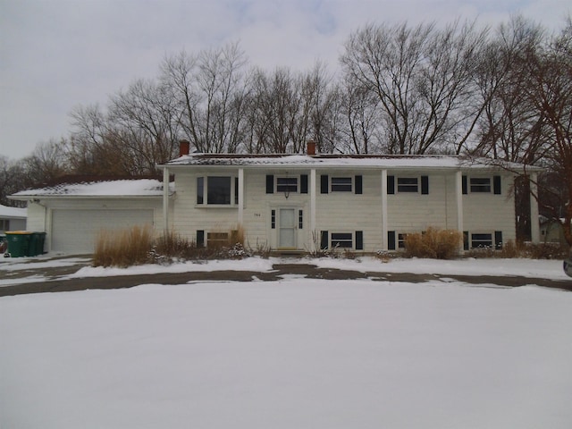 bi-level home featuring a chimney