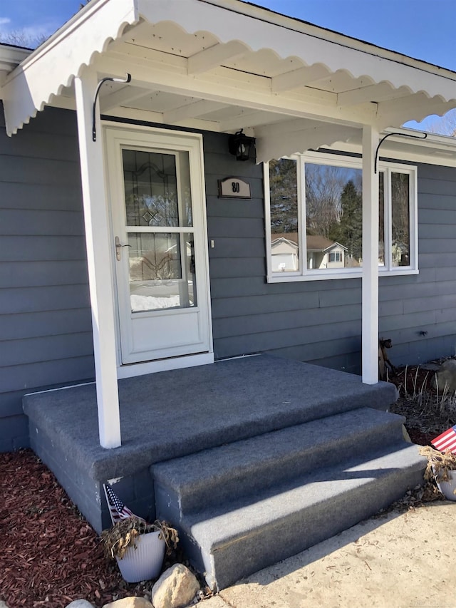 doorway to property with a porch