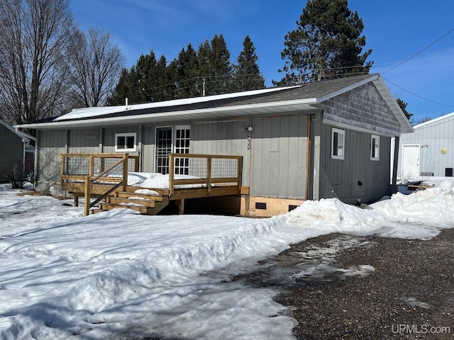 view of front of property with a wooden deck and crawl space