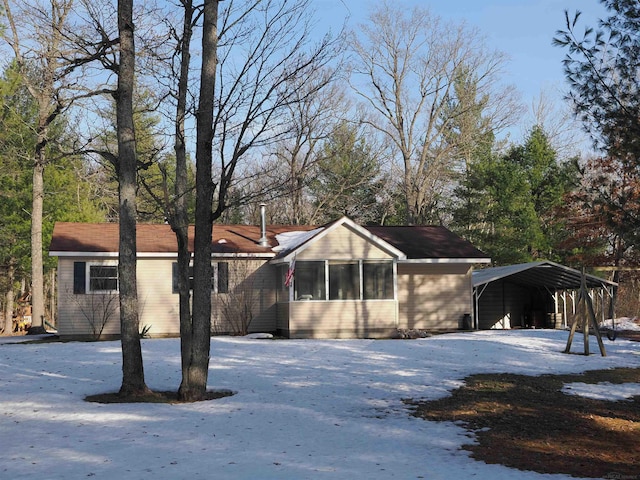 view of front of property with a detached carport