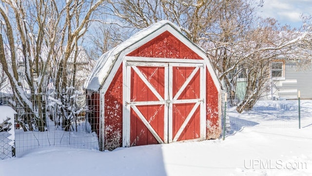 513 W Sagola Ave, Kingsford, MI 49802 - snow covered structure with a storage shed