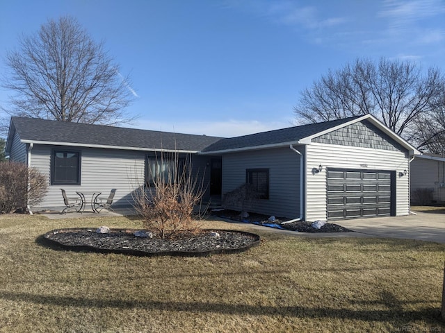 ranch-style home with a garage, driveway, roof with shingles, and a front yard