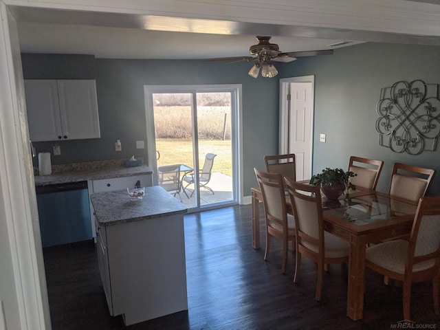 dining room featuring dark wood finished floors, baseboards, and a ceiling fan