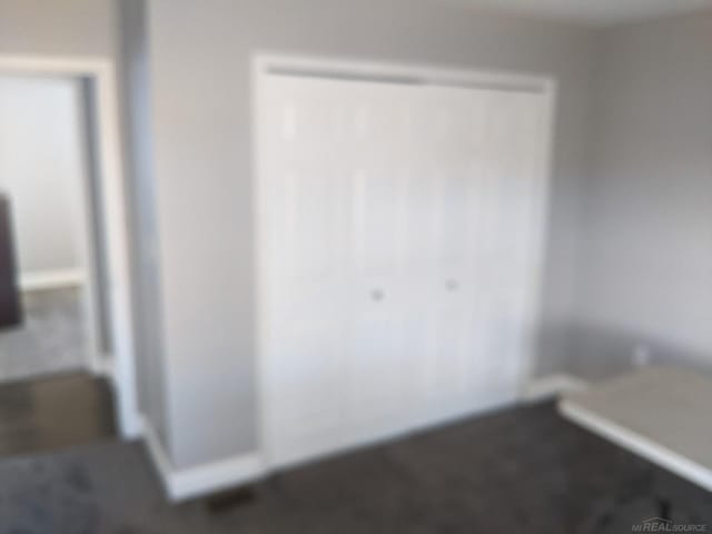 unfurnished bedroom featuring a closet