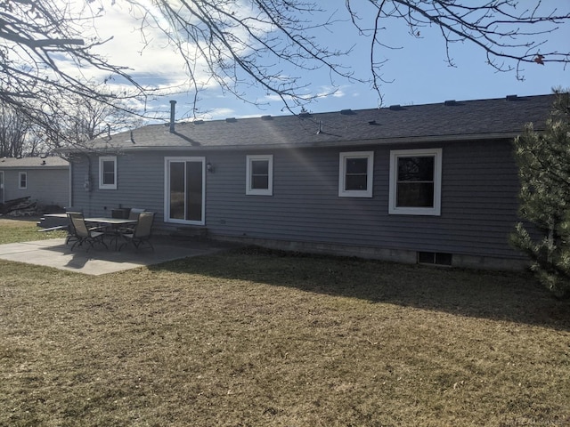 rear view of house featuring a patio, a lawn, and roof with shingles