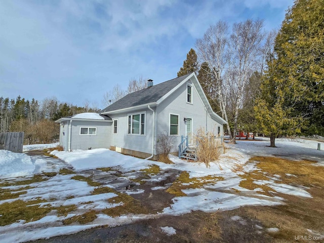 view of front of home featuring an outbuilding