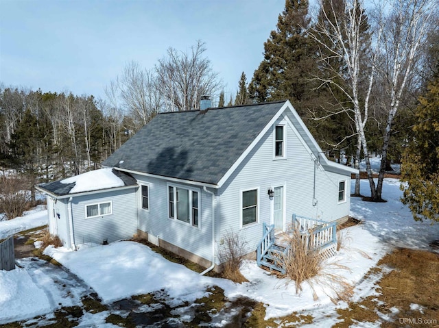 view of front of home featuring a chimney