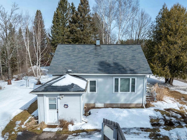 view of front of house featuring a chimney