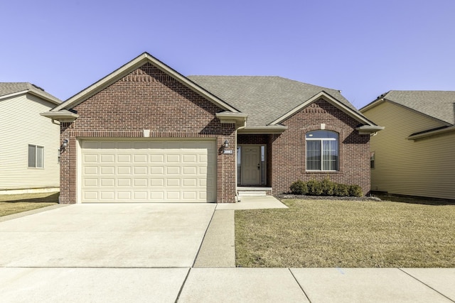 single story home with a front yard, an attached garage, a shingled roof, concrete driveway, and brick siding