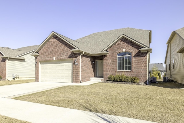 single story home with a garage, central air condition unit, brick siding, and concrete driveway