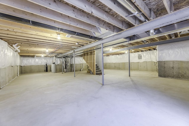 unfinished basement featuring heating unit