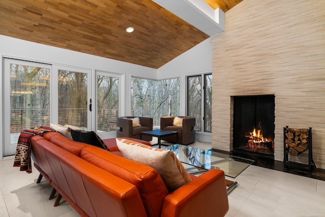 sunroom / solarium with lofted ceiling, wood ceiling, and a fireplace