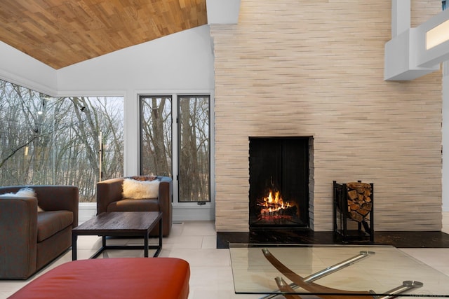 tiled living area with wooden ceiling, high vaulted ceiling, and a brick fireplace