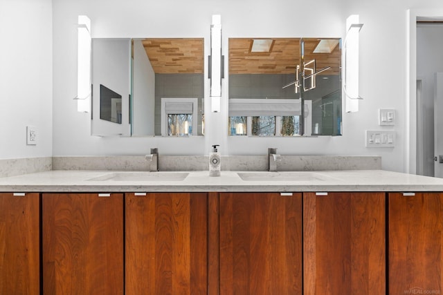 full bathroom featuring double vanity and a sink