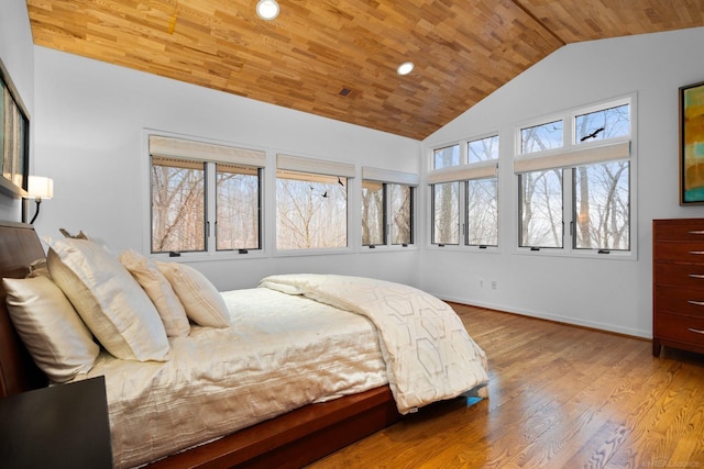 bedroom featuring wood finished floors, wood ceiling, baseboards, and lofted ceiling