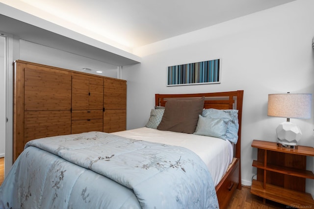 bedroom featuring wood finished floors