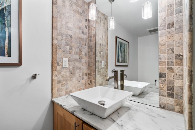 bathroom featuring visible vents and vanity