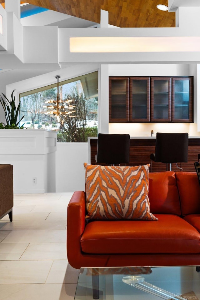 living room featuring tile patterned flooring and wood ceiling