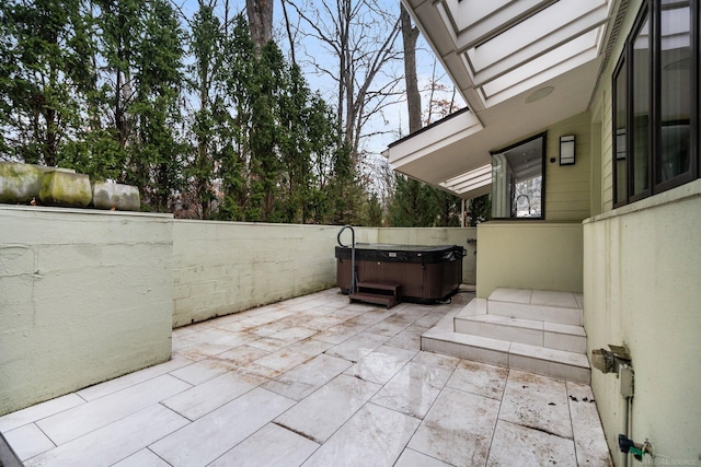 view of patio / terrace featuring a hot tub