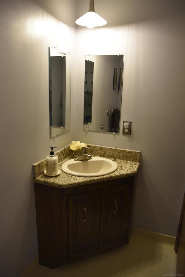 bathroom featuring vanity and baseboards