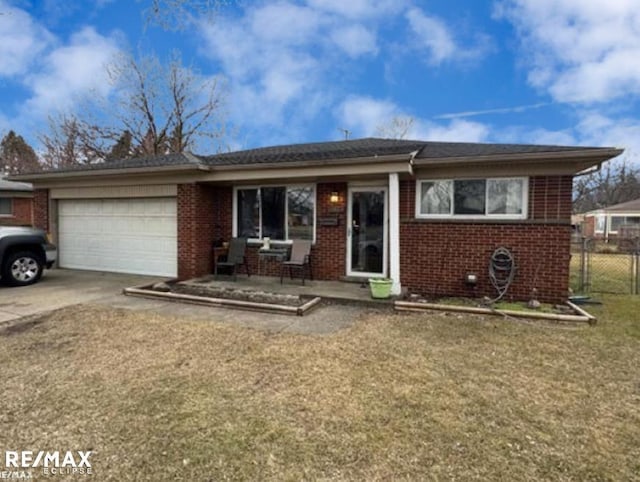 ranch-style house featuring a garage, fence, brick siding, and driveway