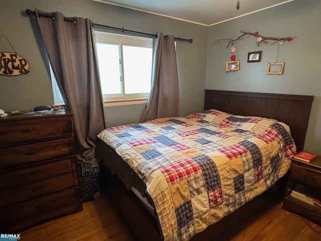 bedroom featuring wood finished floors