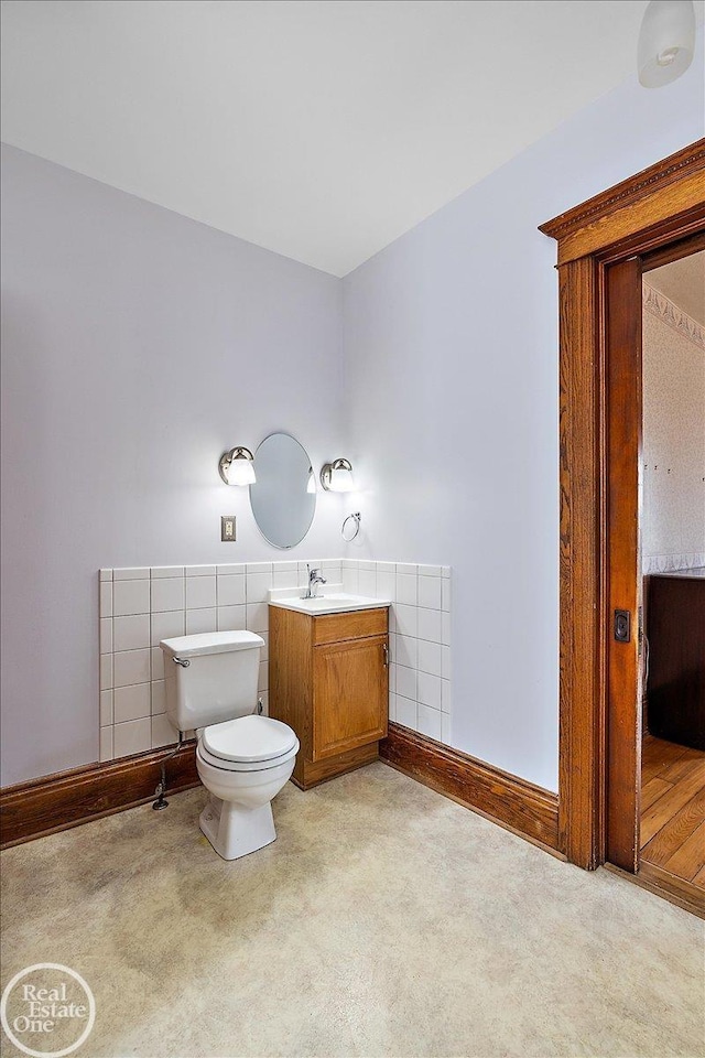 bathroom featuring toilet and vanity