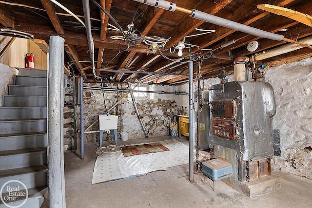 basement with water heater and a sink