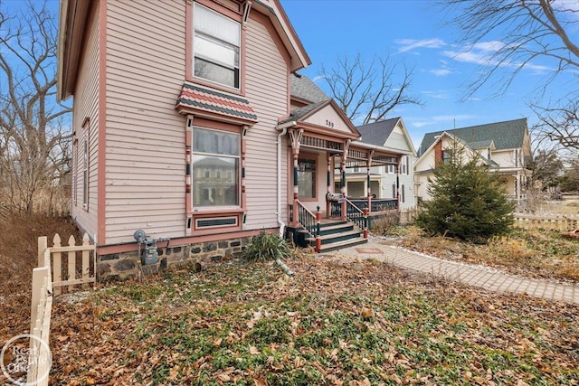 view of front of house with fence