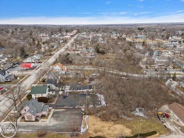 birds eye view of property with a residential view