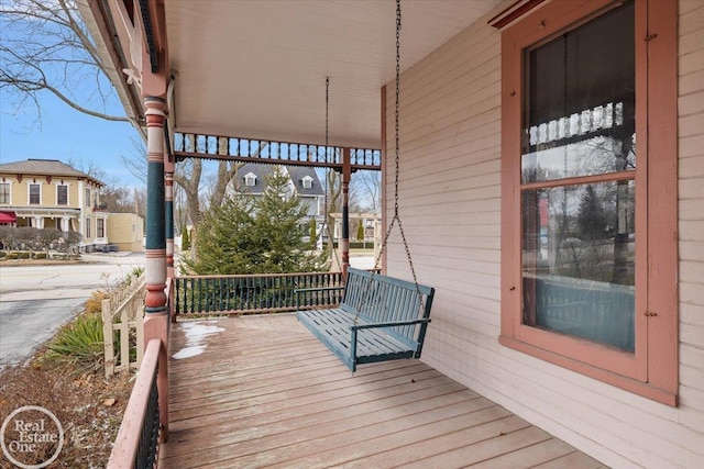 wooden terrace featuring a residential view