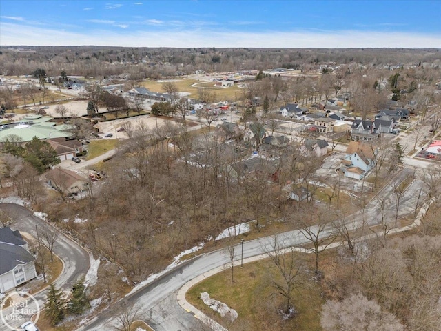 birds eye view of property with a residential view