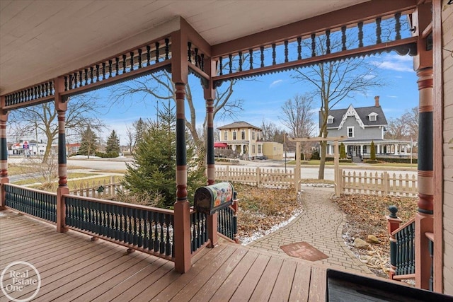 wooden terrace with a residential view