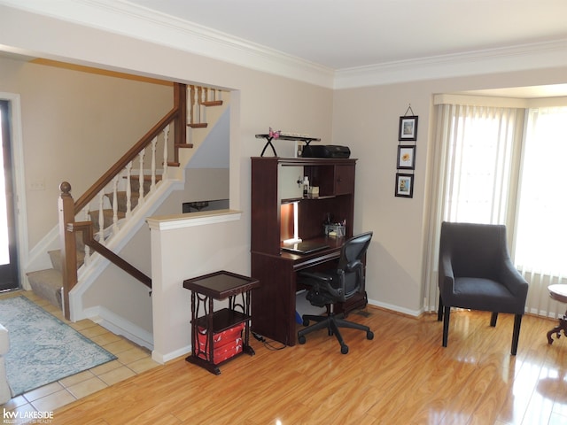 office space featuring baseboards, wood finished floors, and crown molding